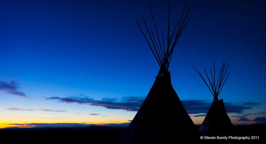 two tipis at sunset